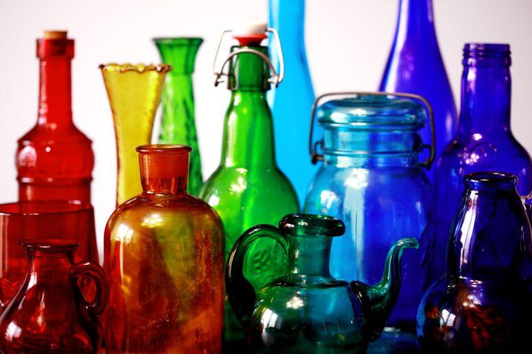 Declutter your home by keeping on top of all your stuff like this collection of colourful bottles