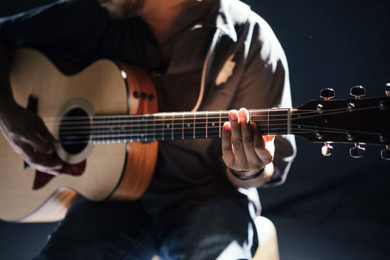 Man playing an acoustic guitar