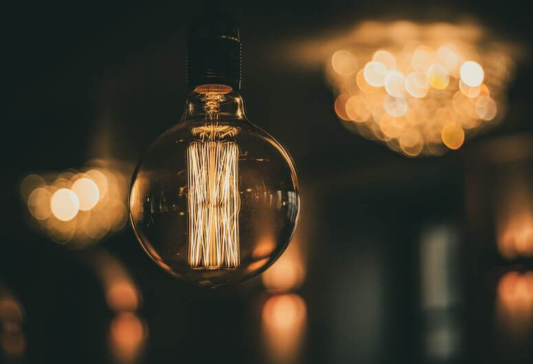 Glowing lightbulb represents the solutions we can find when we tap into our intuitive thinking